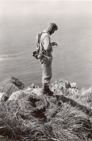 The expedition’s natural scientists travelled to the island Nightingale. This photograph shows the geologist Dunne taking notes on top of the island.
