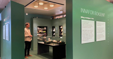 A man standing in an exhibition room